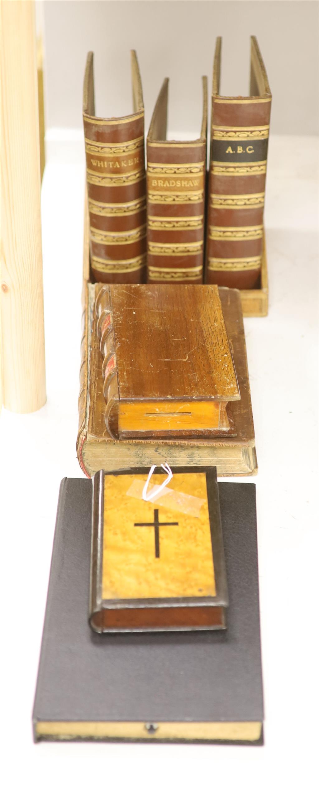A small leather bookshelf, leather book covers, a novelty wooden book money box, etc.